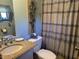 Clean bathroom with granite countertop, updated fixtures, and a patterned shower curtain at 27920 Millersburg Rd, Arcadia, IN 46030