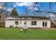 House exterior view showcasing a picnic table and grassy yard at 282 N Wagon Rd, Bargersville, IN 46106