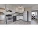 Updated kitchen featuring white cabinets, stainless steel appliances, and vinyl flooring at 282 N Wagon Rd, Bargersville, IN 46106