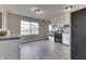 Modern kitchen with white cabinets, stainless steel appliances, and vinyl flooring at 282 N Wagon Rd, Bargersville, IN 46106