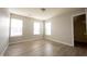 Bright bedroom with two windows, neutral walls, and wood-look tile flooring at 3142 Autumn Run, Bargersville, IN 46106