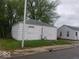 White house with small yard and street view at 3722 N Emerson Ave, Indianapolis, IN 46218