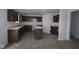 Spacious kitchen featuring dark brown cabinets and an island at 3912 Highcrest Rd, Indianapolis, IN 46239