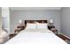 Bright bedroom with a wooden headboard, side tables, and white bedding at 4022 N New Jersey St, Indianapolis, IN 46205