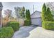 Detached garage with double doors and manicured landscaping at 4022 N New Jersey St, Indianapolis, IN 46205