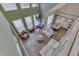 High-ceiling living room with hardwood floors, two sofas, and an open floor plan at 4314 Lantern Rd, Martinsville, IN 46151