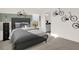 Stylish bedroom featuring a gray bed frame, bicycle decor and an ensuite bathroom at 4342 Chital Pl, Greenwood, IN 46143