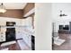 Open concept kitchen and living room with white cabinets and dark wood floors at 7039 Harness Lakes Dr, Indianapolis, IN 46217