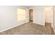 Bright bedroom with window, neutral walls, and carpet at 7134 Langham Ct, Indianapolis, IN 46259