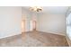 Spacious bedroom with ceiling fan and carpet flooring at 7134 Langham Ct, Indianapolis, IN 46259