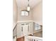 Two-story foyer with hardwood floors, chandelier, and staircase at 7134 Langham Ct, Indianapolis, IN 46259