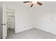 Bedroom with ceiling fan and walk-in closet at 7548 Crickwood Ln, Indianapolis, IN 46268