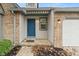 Blue front door with sidelights, and a small porch at 7548 Crickwood Ln, Indianapolis, IN 46268