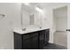 Bathroom with double vanity and dark brown cabinets at 8962 Rowling Way, Indianapolis, IN 46239