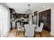 Modern kitchen with dark wood cabinets and stainless steel appliances at 9425 Lindsey Ct, Noblesville, IN 46060