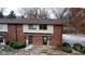 Aerial view of a brick townhouse with snow on the ground at 1068 Greenwood Trail W W Dr, Greenwood, IN 46142