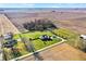 Aerial view of house, expansive yard, and surrounding farmland at 11262 N Everett Rd, Monrovia, IN 46157