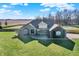 Brick house with large yard, driveway, and fenced area at 11262 N Everett Rd, Monrovia, IN 46157