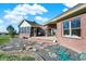 Brick patio and sprawling backyard with a screened porch at 11262 N Everett Rd, Monrovia, IN 46157