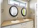 Bathroom with double vanity, oval mirrors, and neutral colors at 11262 N Everett Rd, Monrovia, IN 46157