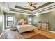 Serene bedroom with hardwood floors and a coffered ceiling at 11262 N Everett Rd, Monrovia, IN 46157