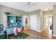 Light-filled bedroom with hardwood floors and built-in desk at 11262 N Everett Rd, Monrovia, IN 46157