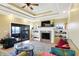 Gathering room with fireplace, built-in shelving, and sliding glass doors at 11262 N Everett Rd, Monrovia, IN 46157