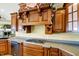 Spacious kitchen with wood cabinets, gas cooktop, and granite countertops at 11262 N Everett Rd, Monrovia, IN 46157