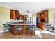 Kitchen with an island, custom cabinetry, and a breakfast bar at 11262 N Everett Rd, Monrovia, IN 46157