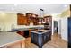 Kitchen with island, dark cabinetry, and stainless steel appliances at 11262 N Everett Rd, Monrovia, IN 46157