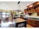 Kitchen with island, hardwood floors, and custom cabinetry at 11262 N Everett Rd, Monrovia, IN 46157