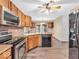 Kitchen with stainless steel appliances and wood cabinets at 13010 E Legal Tender Rd, Columbus, IN 47203