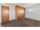 Simple bedroom with wood closet and brown carpet at 1441 Roberts Rd, Franklin, IN 46131