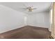 Simple living room with brown carpet, and a ceiling fan at 1441 Roberts Rd, Franklin, IN 46131