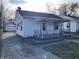 White house with driveway and side yard at 1809 E Hines St, Muncie, IN 47303