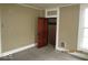 Bedroom featuring neutral walls and wood doors at 205 S Arsenal Ave, Indianapolis, IN 46201