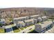 Aerial view of townhouses with landscaping and parking at 308 Brunswick Way, Zionsville, IN 46077