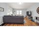 Spacious living room with hardwood floors and a gray couch at 315 W 37Th St, Anderson, IN 46013