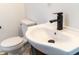 Close-up view of a modern bathroom sink with a sleek black faucet at 3712 N Bancroft St, Indianapolis, IN 46218