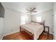 Large bedroom with a king-size bed, wooden dresser and wood floors at 3822 Fernway Dr, Anderson, IN 46013