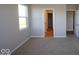 Bedroom with carpet, window and access to hallway and bathroom at 3950 Bozeman Way, Bargersville, IN 46106