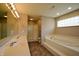 Bathroom with double vanity, soaking tub, and shower at 4126 S Black Oak Ln, New Palestine, IN 46163