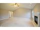 Spacious living room with vaulted ceiling and fireplace at 4126 S Black Oak Ln, New Palestine, IN 46163