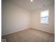 Spacious bedroom with neutral carpeting and a large window at 5607 Tart Blvd, Indianapolis, IN 46239