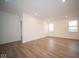 Spacious bonus room featuring hardwood floors and multiple windows at 5607 Tart Blvd, Indianapolis, IN 46239