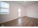 Bright dining area with hardwood floors and access to backyard at 5607 Tart Blvd, Indianapolis, IN 46239