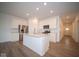 Modern kitchen with white cabinets, center island and stainless steel appliances at 5607 Tart Blvd, Indianapolis, IN 46239