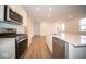 Modern kitchen with stainless steel appliances and white cabinetry at 5607 Tart Blvd, Indianapolis, IN 46239