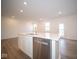 Modern kitchen with island, stainless steel appliances and white cabinets at 5607 Tart Blvd, Indianapolis, IN 46239