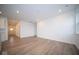 Bright and airy living room with hardwood floors and access to kitchen at 5607 Tart Blvd, Indianapolis, IN 46239